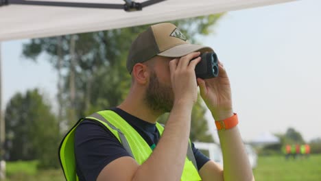 drone teacher using spotting scope at workshop