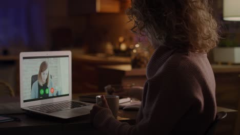 video of woman during video conference with her boss