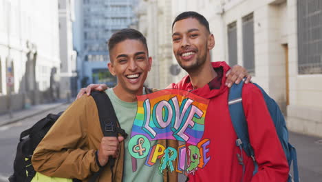 animation of love and pride over gay couple embracing on street