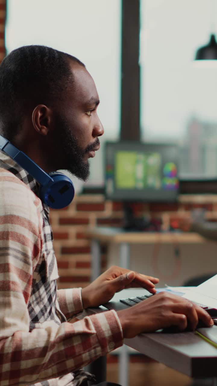 Vertical video: Young professional retoucher editing images on retouching software