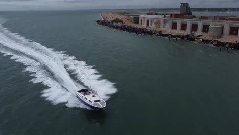 small boat blasting past hurst castle