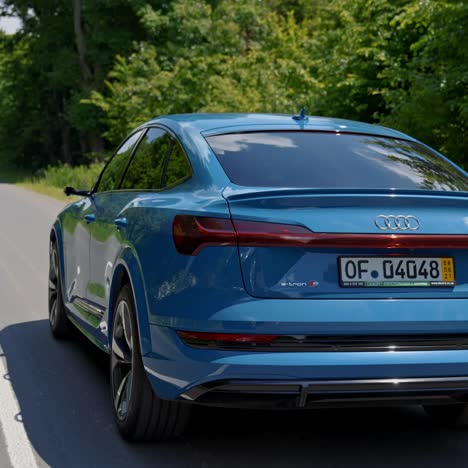 audi e-tron full electric car. new audi e-tron fully electric vehicle on road