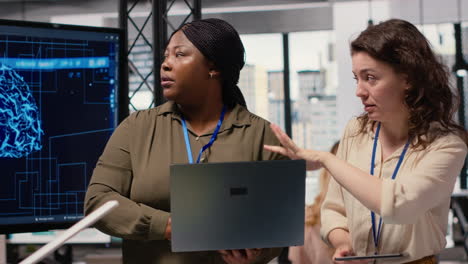 vertical video diverse management staff reviewing advanced ai algorithms and predictive models