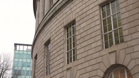 view of external architecture of manchester central library during a cloudy day in manchester, england