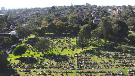 Aerial-drone-wide-shot-over-a-large-cemetery-in-Australia-on-a-sunny-day