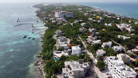 beautiful aerial drone tilt-up a shot over the south side of isla mujeres island in quintana roo mexico on a bright sunny day