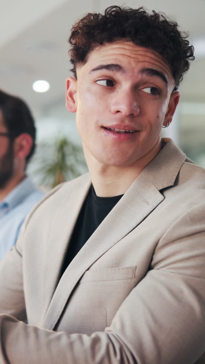 Young Professional Man Listening Attentively in an Office Meeting