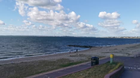 sunny-seaside-beach-on-the-south-coast-of-england-very-early-in-the-morning-before-all-of-the-tourists-flock-to-this-location-to-chill-out-in-the-sun-for-the-day