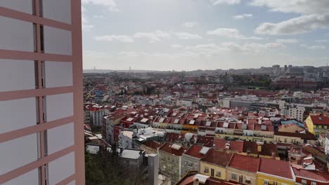 Drone-coming-around-the-corner-and-reviealing-Lisbon