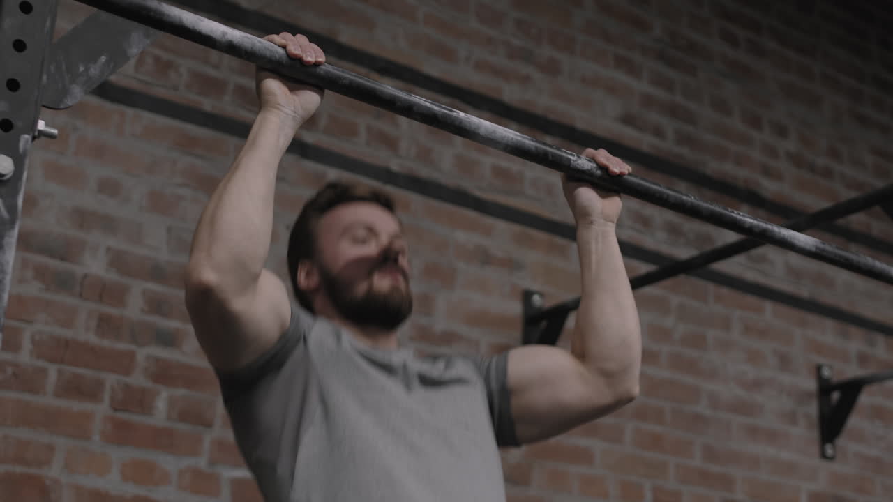 Man Exercising on Horizontal Bar