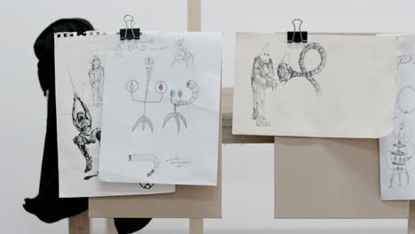 closeup of different designs sketched by the artist