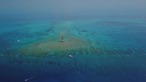 drone shot of sand key lighthouse panning downward at high altitude