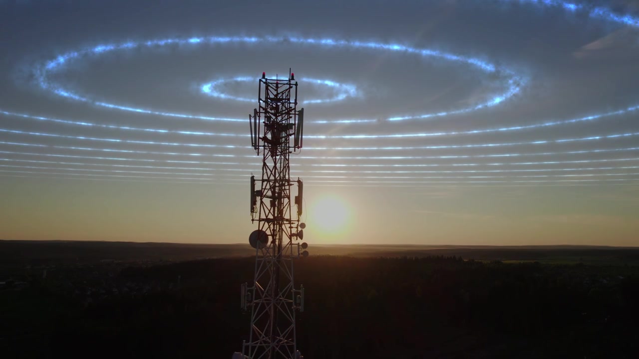 Cell Tower Emitting Digital Signal Waves at Sunset