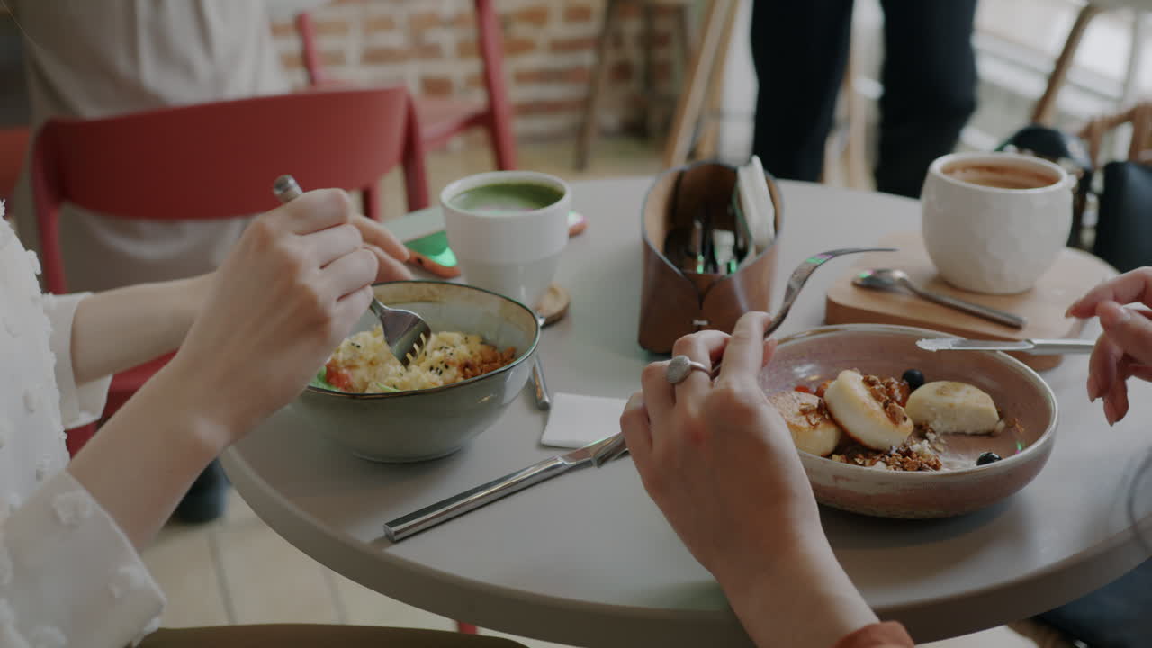 Women Enjoying Breakfast/Lunch at a Cafe