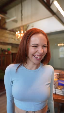 happy woman laughing in bookstore