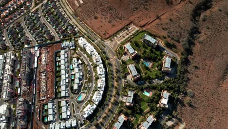 pan left aerial view of a residential condominium in the foothills of las condes, santiago, chile