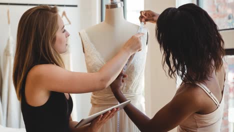 animation of two female fashion designers working in fashion studio