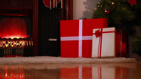 santa delivering gifts under christmas tree