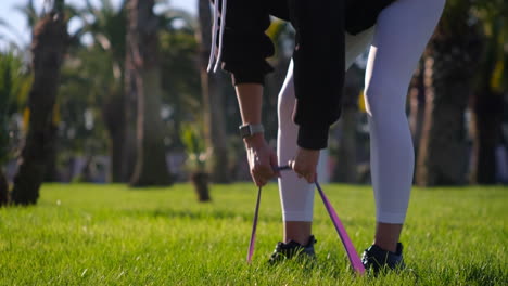 woman exercising with resistance band outdoors