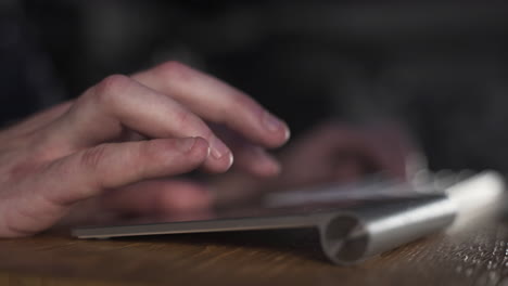 Fingers-nimbly-working-on-a-keyboard-and-touchpad,closeup-of-hands