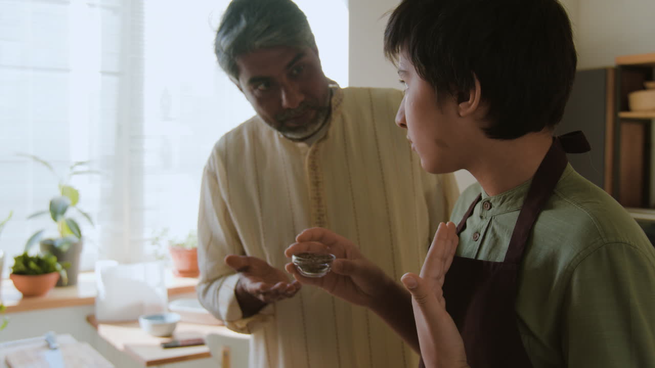 Father and Son Cooking Together in the Kitchen