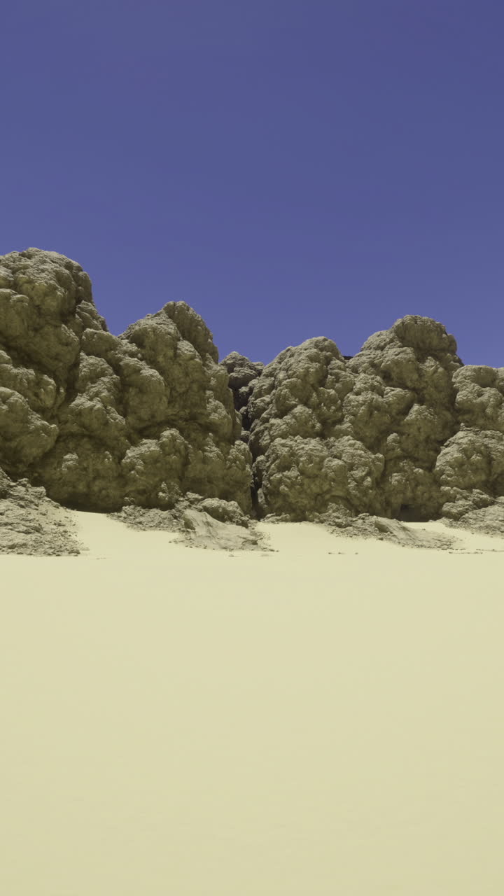 Unique rock formations surrounded by desert sand under a clear blue sky