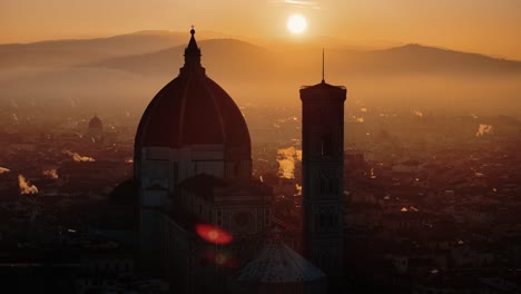 aerial orbit around florence duomo as sunrise casts dramatic shadows