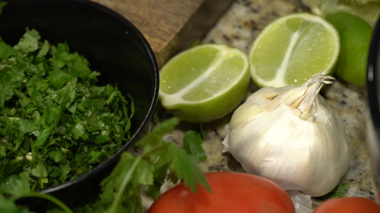 A Layout of Fruits and Vegitables on a Kitchen Counter in Slow Motion.