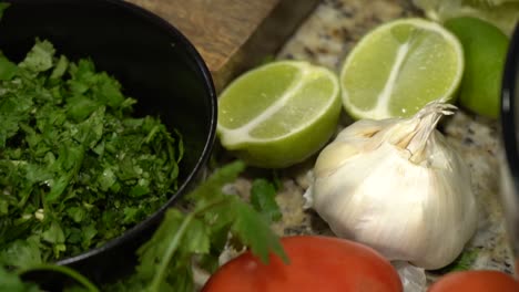 a layout of fruits and vegitables on a kitchen counter in slow motion.