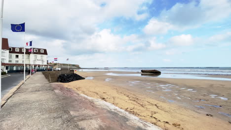 Endless-Beach-in-Normandy-of-France-in-Summer-with-European-Flag