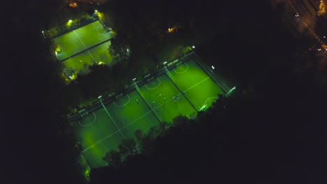 night aerial view of illuminated soccer fields