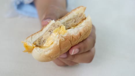 women hand holding beef burger top view ,