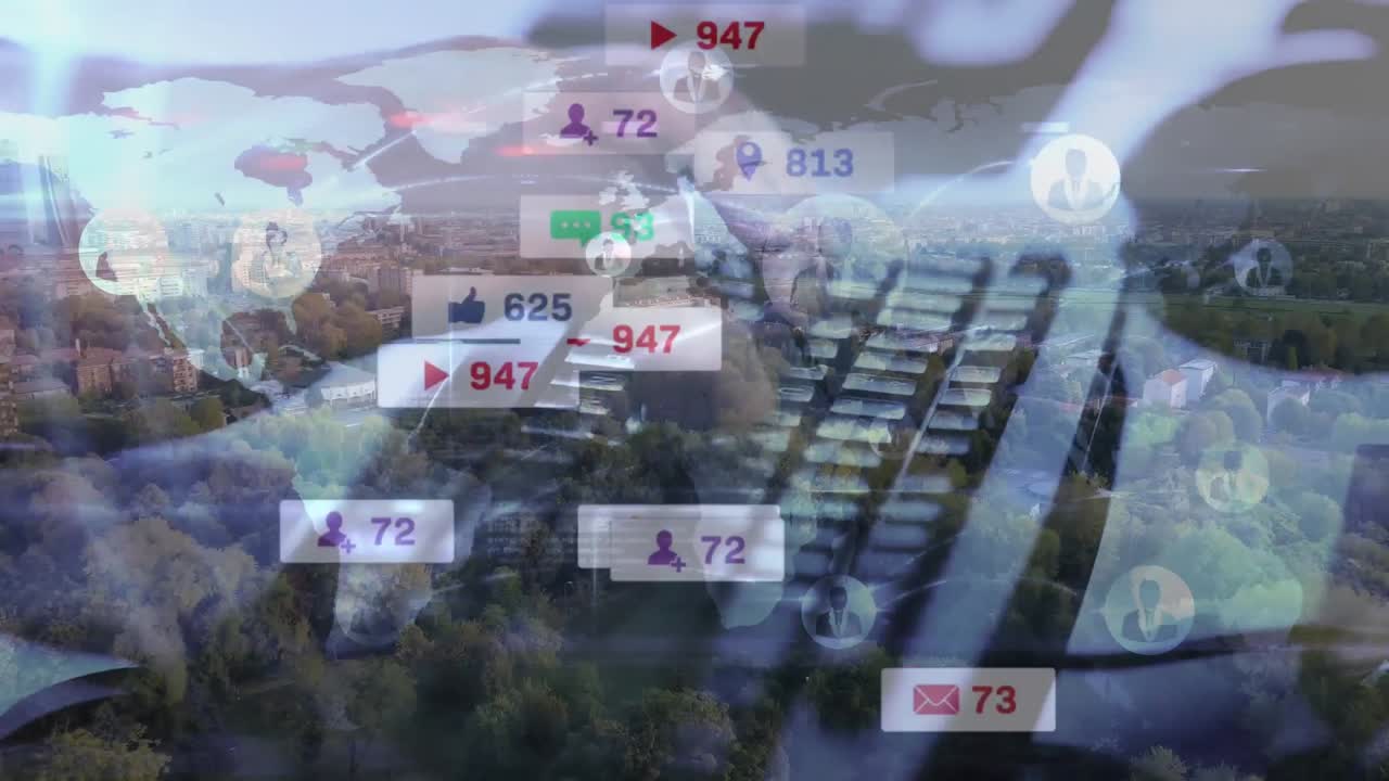 Animation of social media icons and world map over man using laptop and cityscape