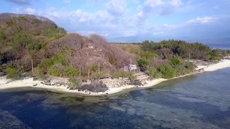 mysterious sunset bar directly on the beach dramatic aerial view flight panorama overview drone footage
of gili t indonesia at sunny summer 2017