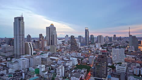 bangkok downtown city panorama overview on sunset from high point of view showing numerous skyscrapers and business centers from top, thailand