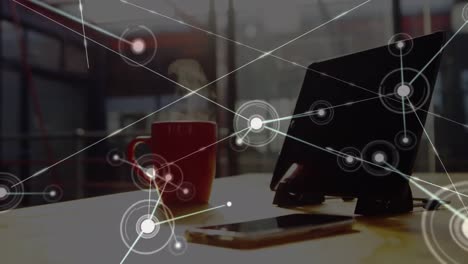 animation of network of connections over man cup of coffee and computer