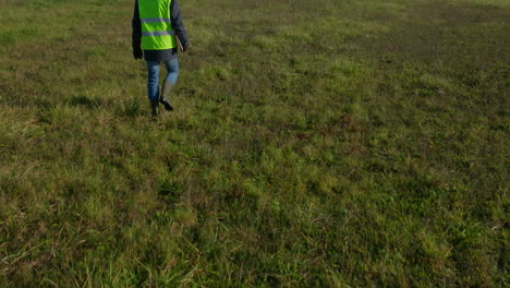 reveal of industrial pylons, countryside location, workman