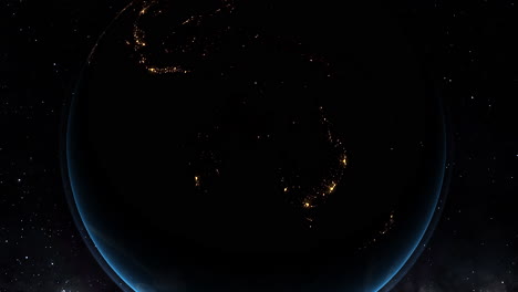 nighttime view of australia from space, city lights glowing against the dark continent