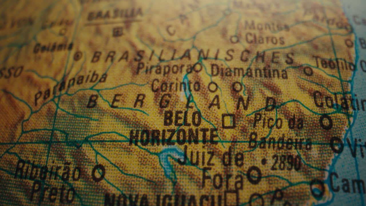 Close-up of a world map, focusing on Belo Horizonte, Brazil.
