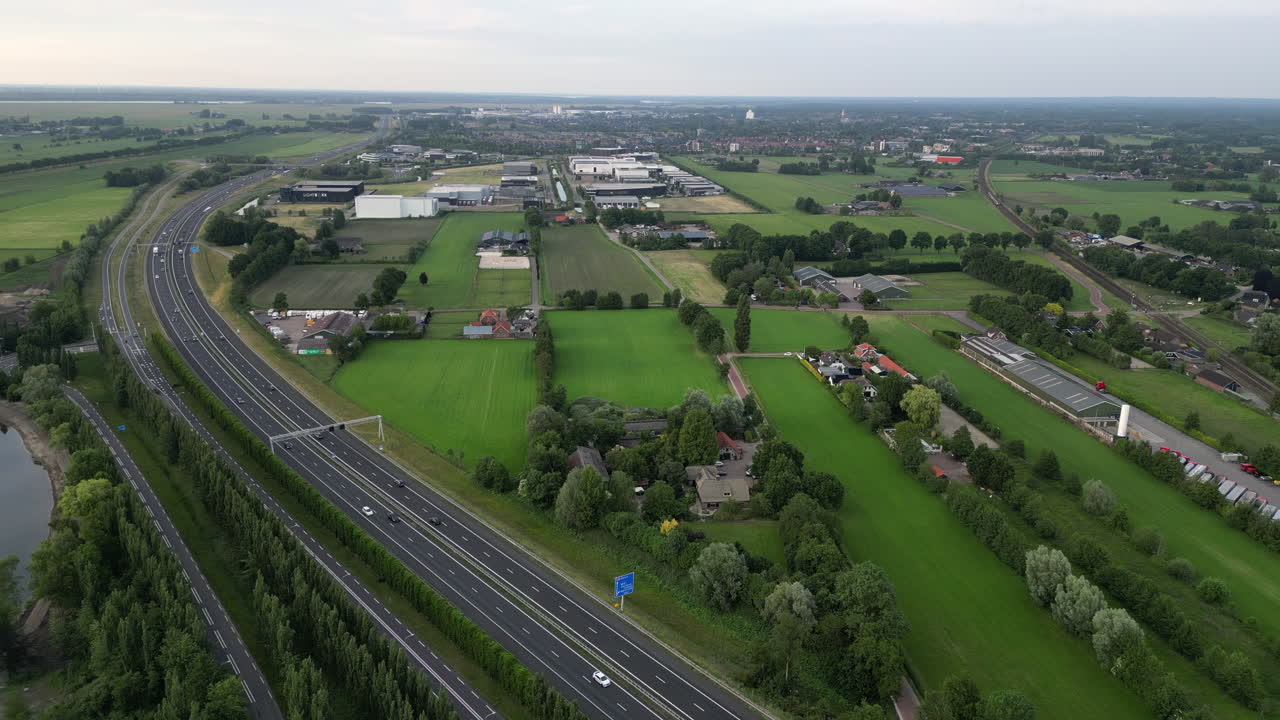 Railway and highway on Amersfoort - 4K Stockvideo