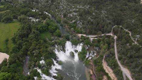 drone view magnificent waterfalls at kravica waterfall in bosnia, beautiful landscape, travel attraction, summer tourism concept