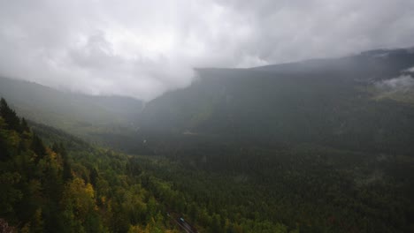 View-of-the-mountains-and-valley-with-dense-fog-in-Glacier-National-Park-west-of-Logans-Pass