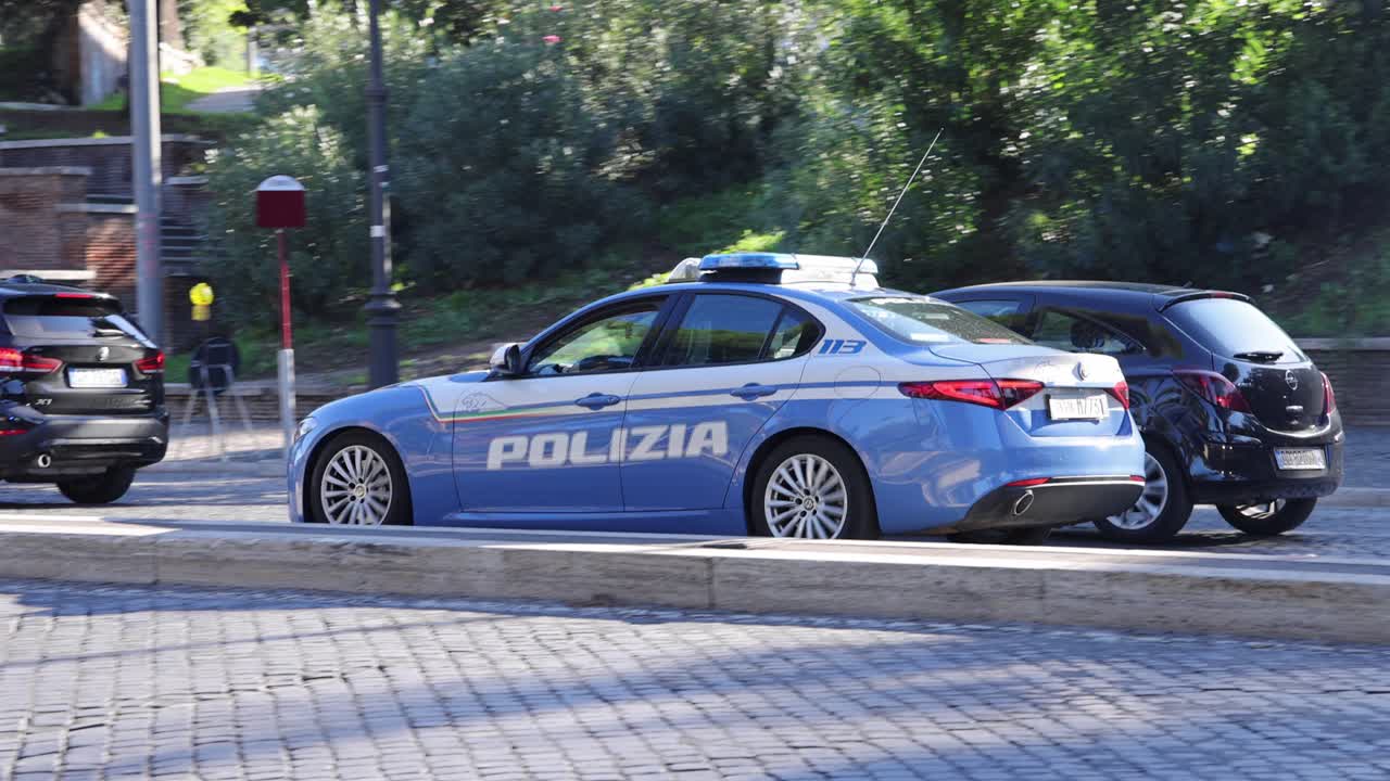Italian Police Car Responding to Emergency in Rome, Italy, Slow Motion