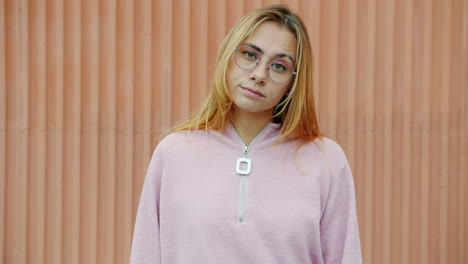 young woman wearing pink hoodie