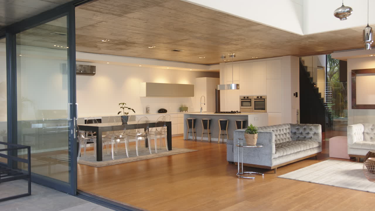 Modern open-concept kitchen and living room with stylish furniture and decor, at home
