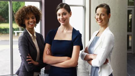 Portrait-of-executives-standing-with-arms-crossed