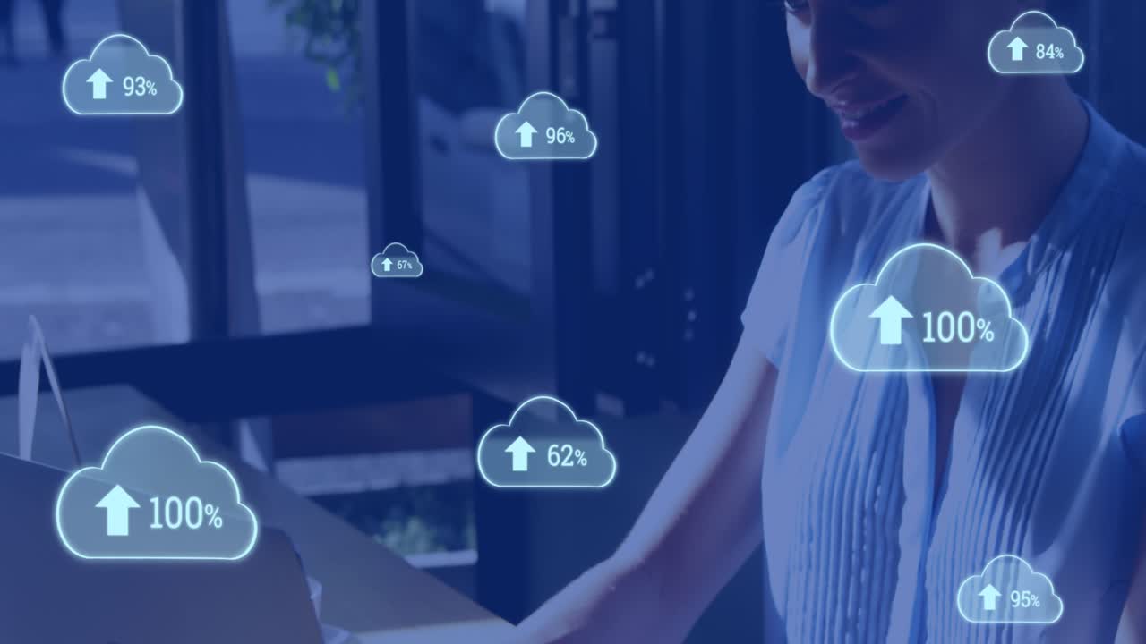 Animation of cloud icons with growing numbers over caucasian woman using laptop
