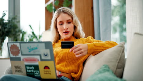 woman using credit card for online shopping on laptop
