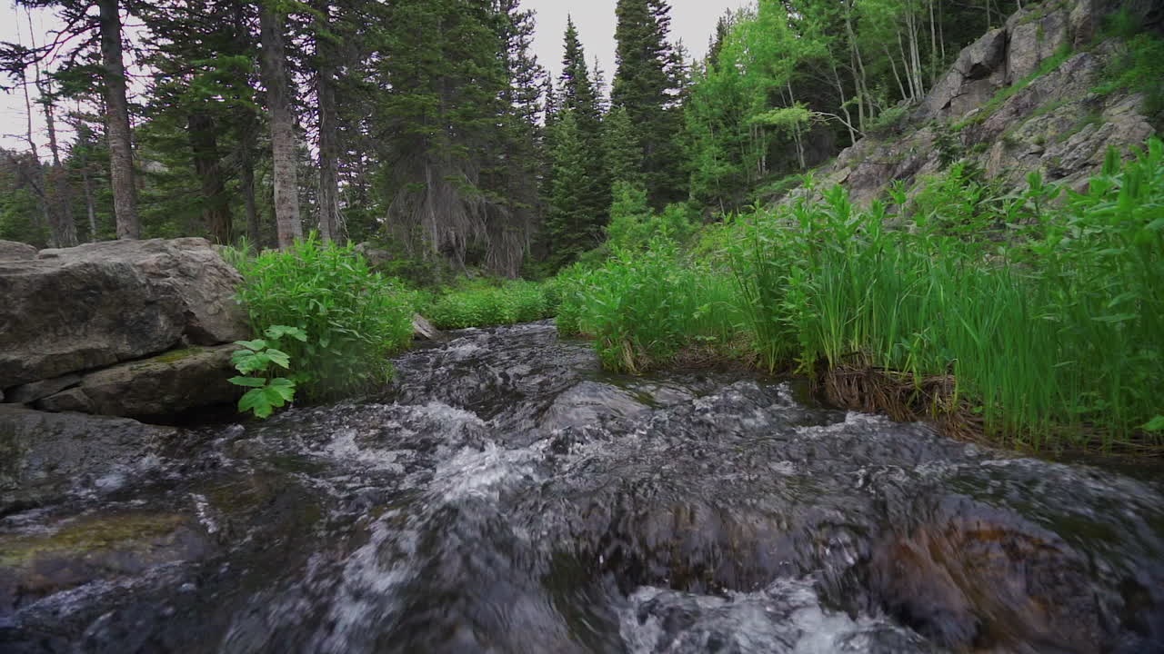 Slow motion water flowing toward camera