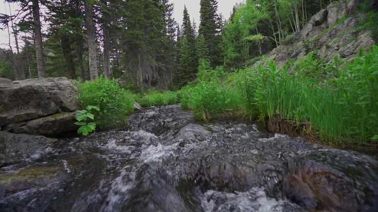 Slow motion water flowing toward camera